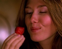 Kaylee Frye enjoys eating a strawberry